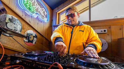 DJ playing music at Sticky Wicket bar.