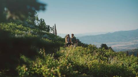 Couple hiking at Deer Valley in the summer.