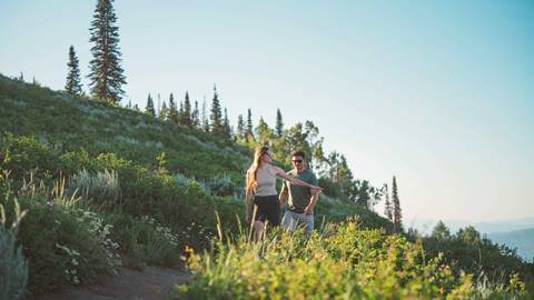 Couple hiking at Deer Valley Resort in Park City, Utah.