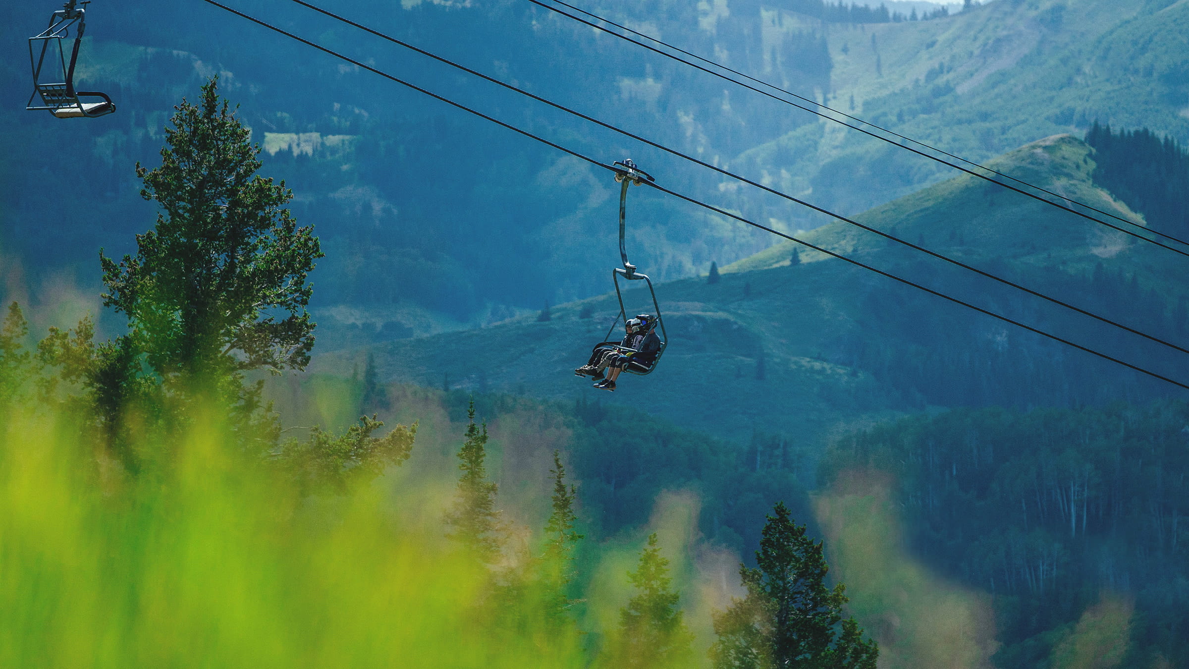 Guests riding chairlift during the summer at Deer Valley Resort.