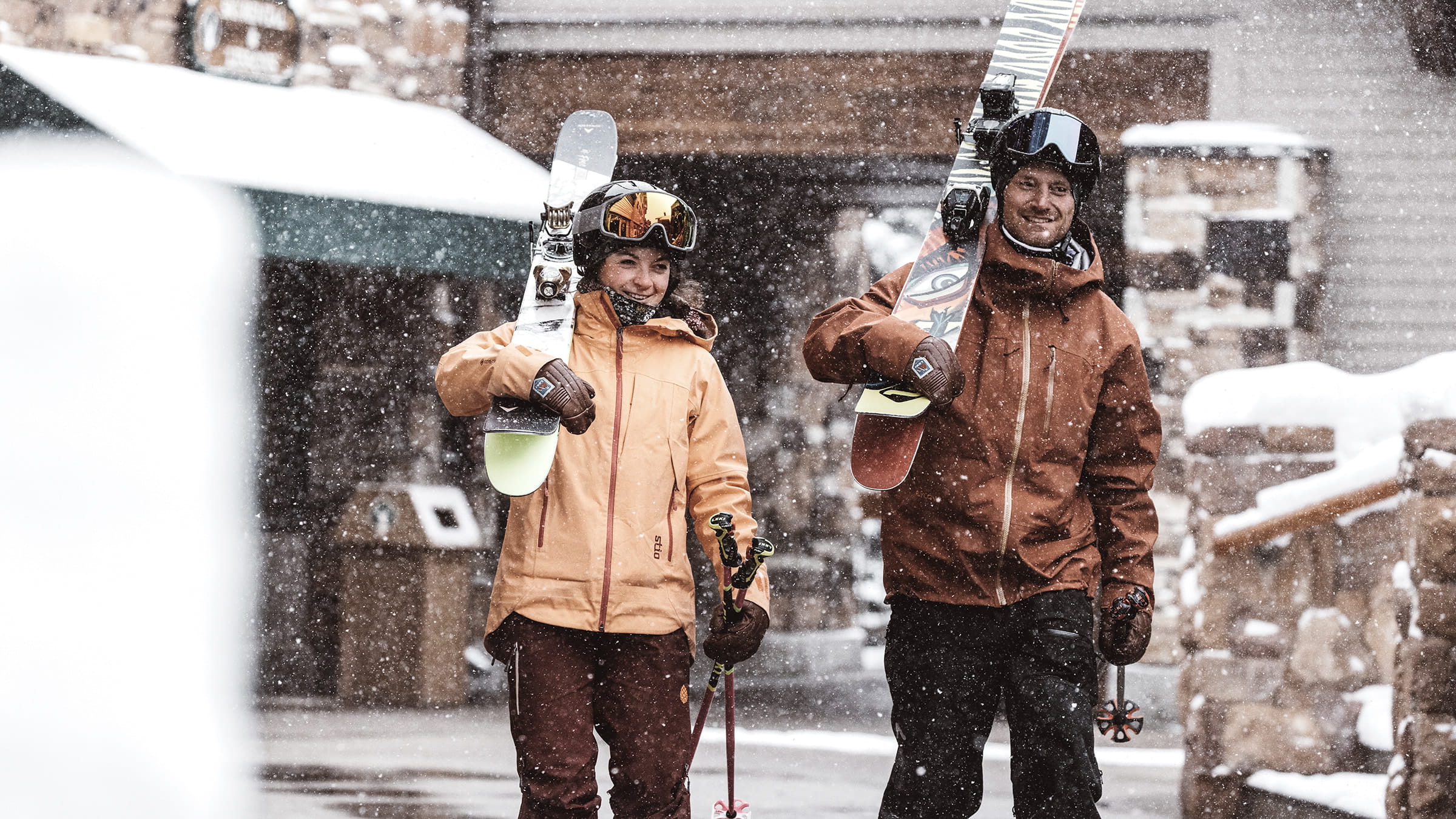 Couple walking with skis.