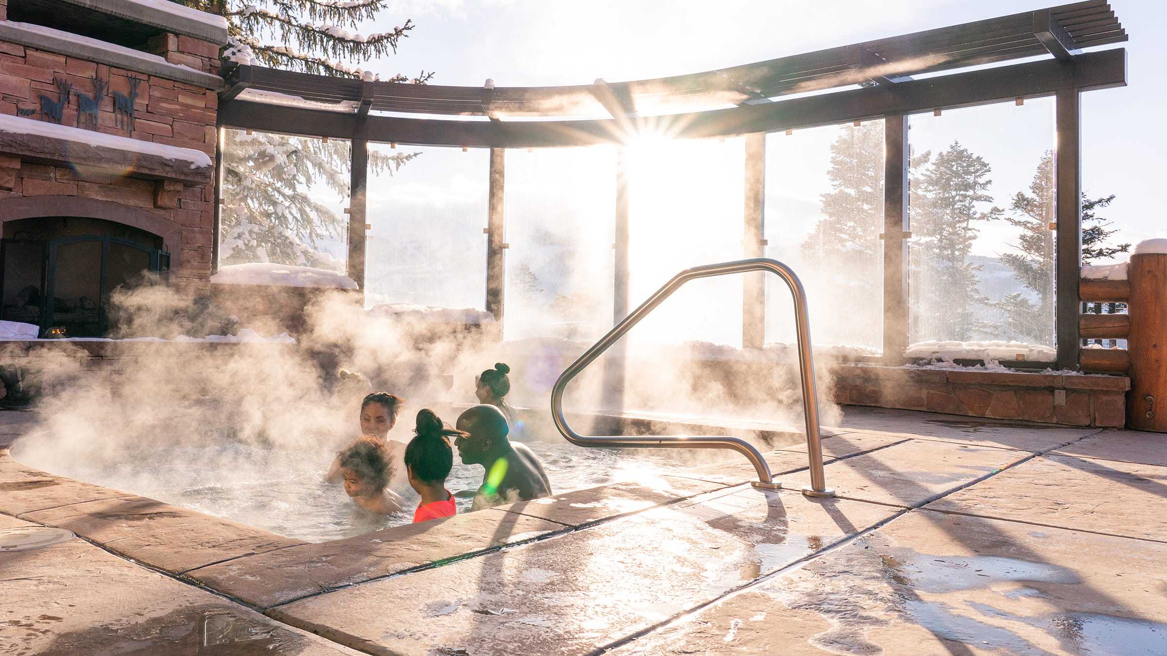 Family relaxing in hot tub.