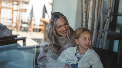 Mom and daughter inside Deer Valley Lodging property.