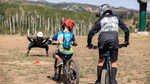 Boys practicing mountain bike techniques with Deer Valley Bike Instructor