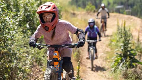 Group of kids mountain biking together during lesson at Deer Valley