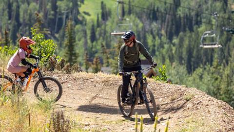 Girl mountain biking with Deer Valley Bike Instructor