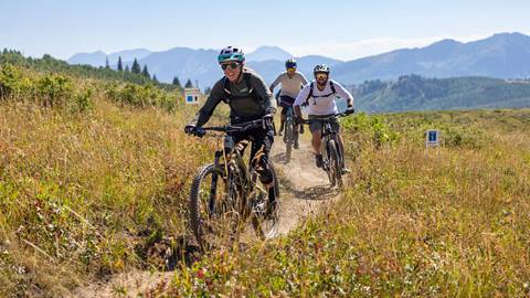 Deer Valley Mountain Bike Instructor leading group.