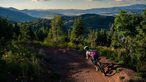 Girl mountain biking at Deer Valley.