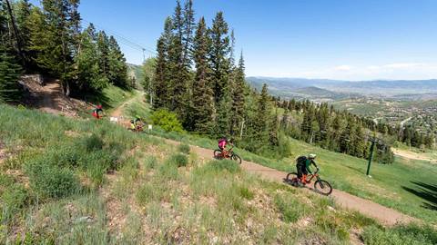 Group of bikers following Deer Valley bike instructor.