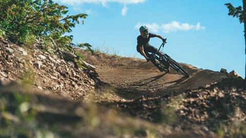 Man mountain biking at Deer Valley Resort in Park City, Utah.