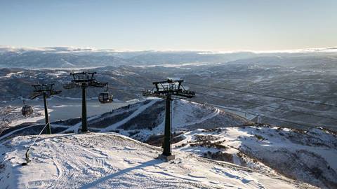 Deer Valley East Village Gondola cabins overlooking the Jordanelle Reservoir in winter.