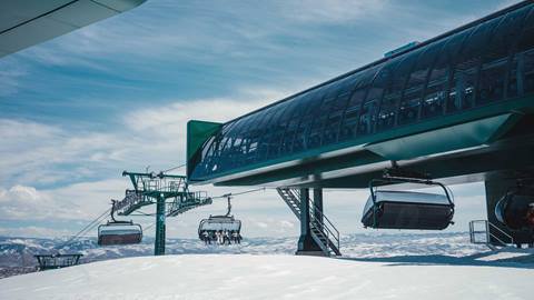 Skiers riding Deer Valley's Keetley Express chairlift.