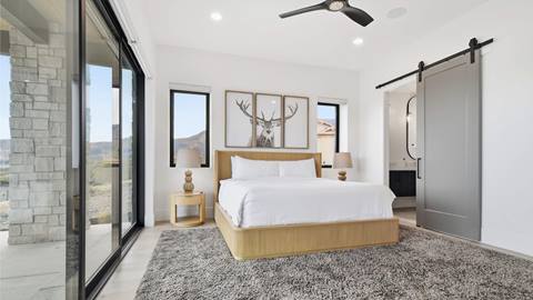 Bedroom with patio access in Deer Valley's luxury lodging property, Amanti Lago 11346.
