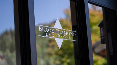 Black Diamond Lodge logo on glass door.