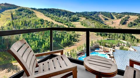 View of mountains and pool during summer from St. Regis Deer Valley balcony