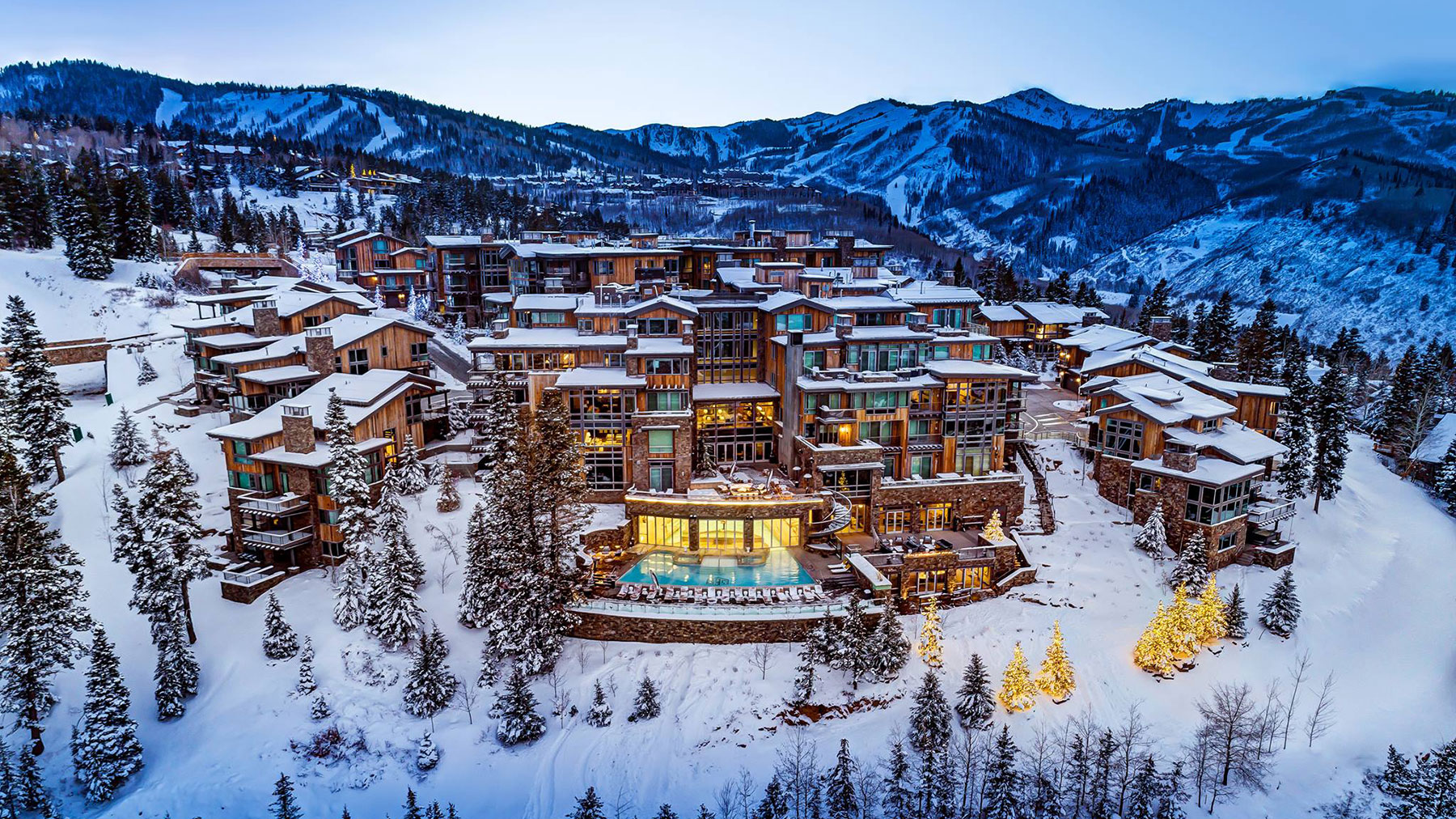 Arial shot of the exterior of Stein Eriksen Residences in winter at dusk