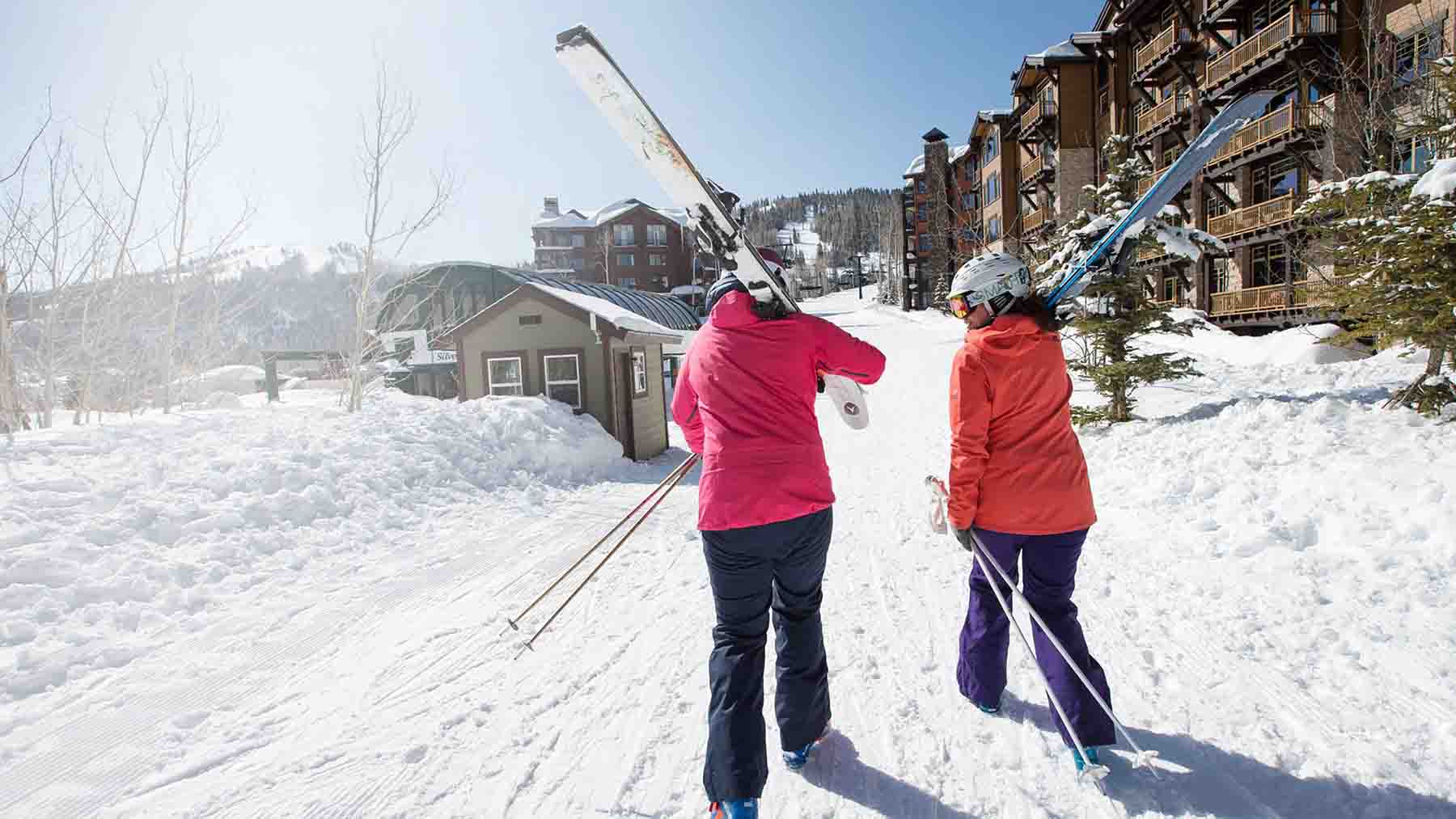 Skiers Walking Towards Chairlift