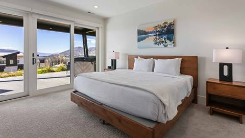 Bedroom with patio and hot tub access in Deer Valley's property SkyRidge 1152.