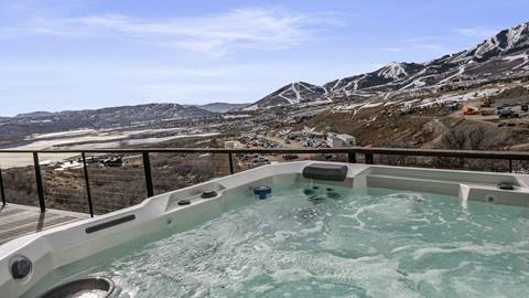 Private hot tub at SkyRidge 1307 with panoramic mountain views.