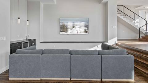 Media room in SkyRidge 1307 with wine fridge and tv.