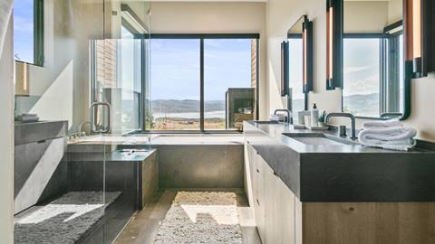 SkyRidge 1585 bathroom featuring walk-in shower, soaking tub, and double vanity