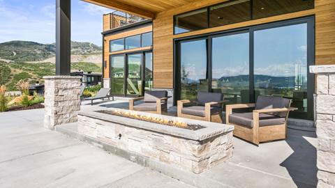 SkyRidge 1585 outdoor patio featuring large fire pit and outdoor furniture