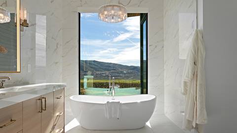 Freestanding bathtub with mountain view inside Deer Valley's luxury lodging property, SkyRidge 1643.