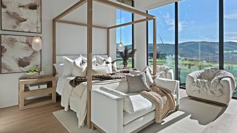 Master bedroom with floor-to-ceiling windows inside Deer Valley's luxury lodging property, SkyRidge 1643.