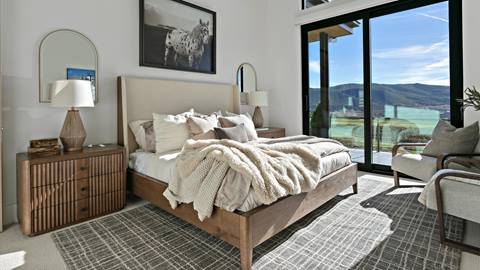Bedroom with view inside Deer Valley's luxury lodging property, SkyRidge 1643.