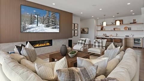 Family room with sectional, fireplace, tv, and bar inside Deer Valley's luxury lodging property, SkyRidge 1643.