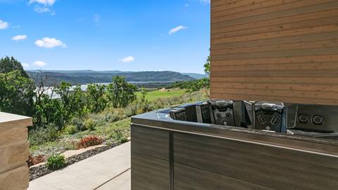Hot tub with lake and mountain views at Deer Valley's luxury lodging property, SkyRidge 1643.