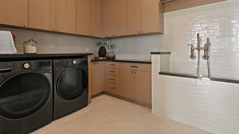 Laundry room with dog bath inside Deer Valley's luxury lodging property, SkyRidge 1643.