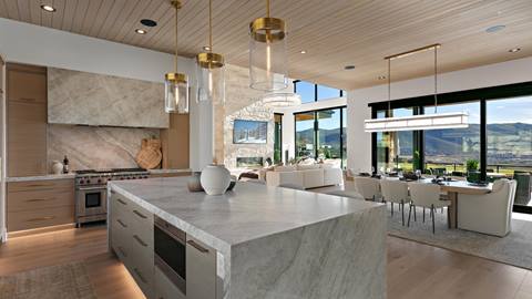 Open concept kitchen, dining, and living room with mountain views at Deer Valley's luxury lodging property, SkyRidge 1643.