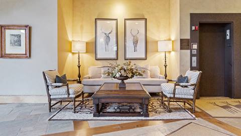Entryway couch in Stag Lodge's common space, inviting and stylish.