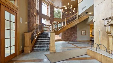 Elegant staircase in the entryway of the Stag Lodge's common space