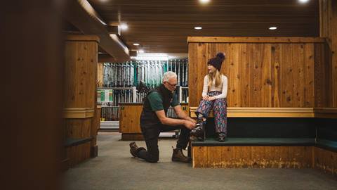 Girl getting fit for rental boots at Deer Valley.