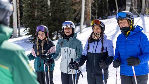 Deer Valley Ski Instructor talking with students in Park City, Utah.