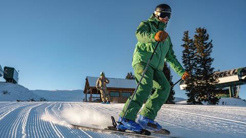 Deer Valley Ski Instructor and student on mountain.