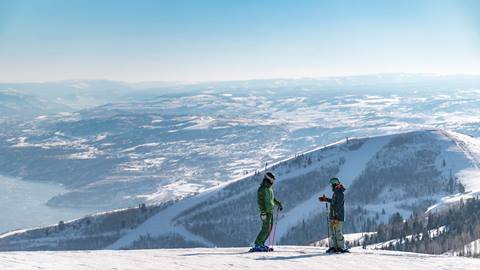 Deer Valley Ski Instructor and student on mountain.