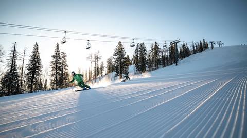 Deer Valley Ski Instructor and student on mountain.
