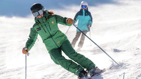 Deer Valley Ski Instructor and student on mountain.