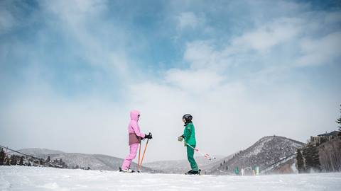 Deer Valley Ski Instructor and student on mountain.
