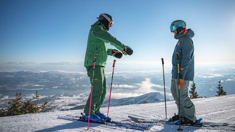 Deer Valley Ski Instructor and student on mountain.