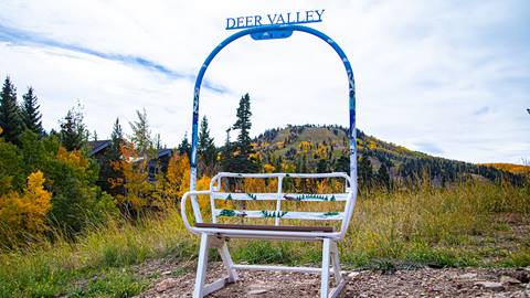 Artistic representation by Lamont Joseph White of two skiers and wild animals on Burns Chair Number 7.
