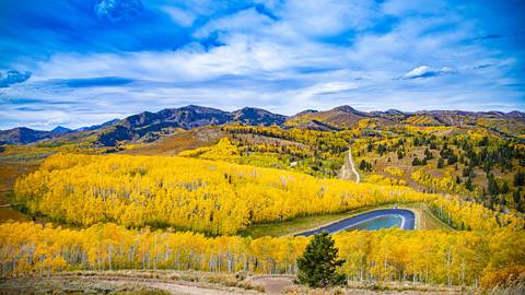 Aspens transitioning to golden hues, painting Deer Valley's landscape in the radiant colors of fall.