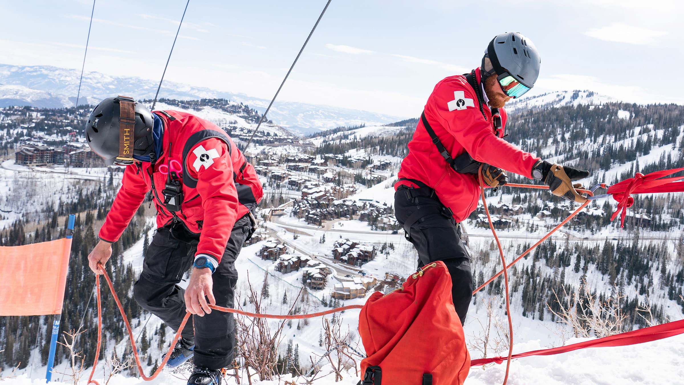 Two ski patrollers preparing for safety training at Deer Valley Resort.