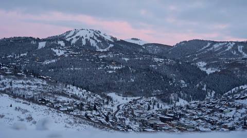 Sunset over Park City, Utah in the winter with a view of Deer Valley.