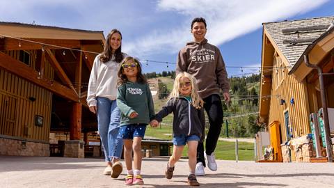 Family of four in Deer Valley clothing