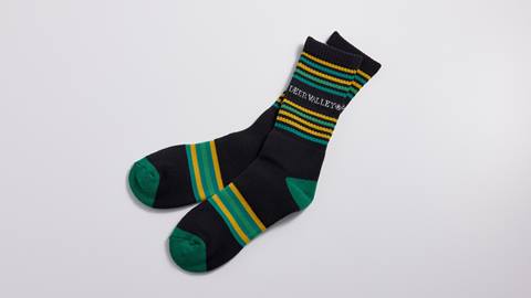 Green, black, and gold Deer Valley socks.