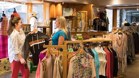 Two woman looking at Deer Valley apparel.